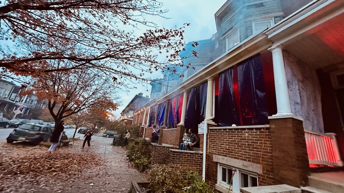 Fabric panels in every porch bay, from the street