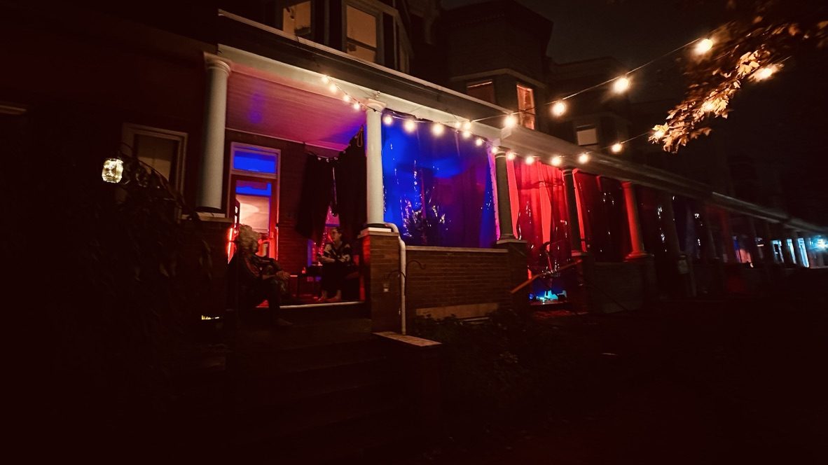 Night: string lights over lit panels